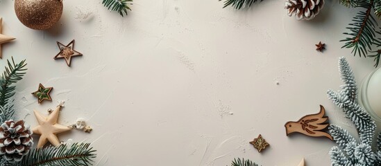 Poster - Minimalistic top down view of a festive flat lay for New Year and Christmas featuring items like fir branches stars and wooden bird figurines set against a light background with spacious copyspace im