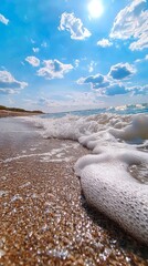 Wall Mural - a view of a beach with waves crashing on the sand