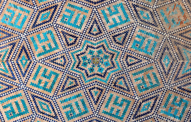 traditional Uzbek pattern on the ceramic tile on the wall of the mosque