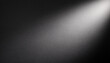 © Arthur - Soft Spotlight on Textured Black Surface. Gradual Transition from Dark to Light Gentle Illumination Effect with Fine, Subtle Grainy Details. Minimalist Aesthetic