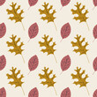 © Nadiia - Seamless pattern with brown oak leaves and pink autumn leaves on a beige background