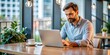 © Stock Spectrum - Focused Man Working on Laptop in Cafe, Man, Laptop, Cafe, Coffee