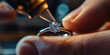 © SnowElf - A master jeweler setting gems into diamond ring, workshop with professional tools