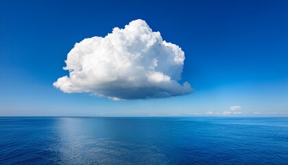 Wall Mural - A single, large, white cloud sits in a bright blue sky above a calm, blue sea