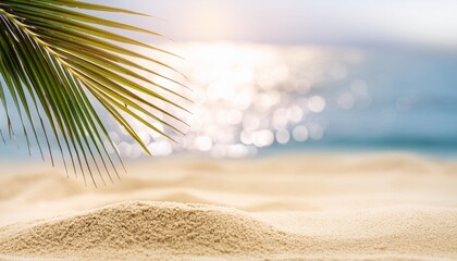 Wall Mural - selective focus on sand with blurred palm on beach bokeh background