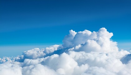 Wall Mural - top of white fluffy clouds and blue sky background