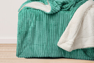 Different soft folded and open blankets 
