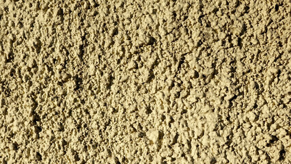 Aufkleber - Textured Plaster Wall With a Rustic Finish, Showcasing Uneven Surface Details in Muted Tones