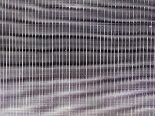 Poster - Textured Grid Surface Background With a Soft Filter Effect Creating Depth and Visual Interest