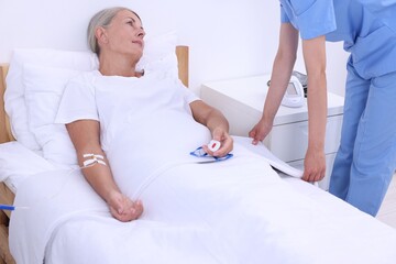 Sticker - Senior woman with emergency call button and nurse in hospital