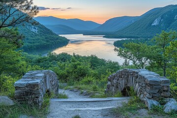 Wall Mural - Stone Archway Overlooking a River Valley at Sunset