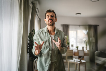 Wall Mural - Portrait of adult man stand and smile at home