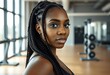 © shelly - Black woman with braids at the gym