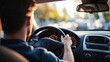 © BetterPhoto - A close-up shot of a person driving a car, focused on the steering wheel and dashboard, representing the daily commute or travel.