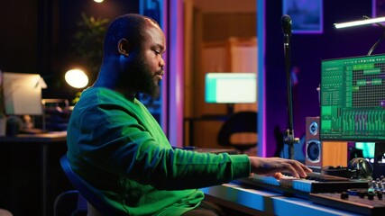 Poster - Modern producer playing piano keys to record new soundtrack, trying to produce song using midi controller electronic keyboard. Songwriter composer playing instrument notes to create tunes. Camera A.
