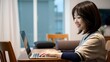 © Yuudaishin - 30代、40代デスクワークをしているアジア人女性　Asian woman in her 30s or 40s working at a desk