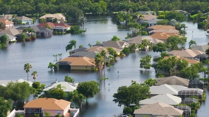 Poster - Flooding in Florida caused by tropical storm from hurricane Debby. Suburb houses in Laurel Meadows residential community surrounded by flood waters in Sarasota. Aftermath of natural disaster