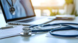 © Steve - Stethoscope and Medical Documents on Desk, Laptop in Background, Bright Office with Natural Light Focusing on Healthcare Technology