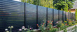 © Александр Марченко - New black horizontal aluminum fence surrounding residential backyard garden