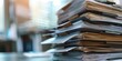 © kwanchaift - A stack of policy documents and manuals with visible headings and text, representing the comprehensive guidelines and procedures used in corporate environments