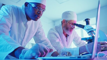 Wall Mural - research chemists analyzing data in innovative laboratory with advanced equipment