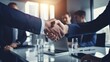 © Prapan - Business partners shaking hands in front of a conference
