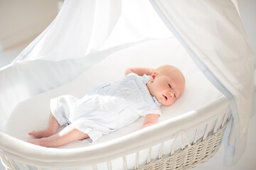 Wall Mural - Little baby on white bed