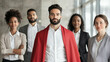 © forenna - A team of five businesspeople standing together, with one businessman dressed in a bold red superhero cape costume. The image highlights leadership, power, and strength, showcasing