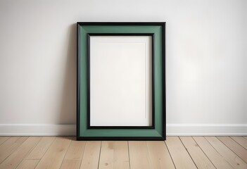 A green wooden picture frame on a wooden floor