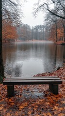 Poster - A bench sits on the edge of a lake in autumn