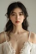 © k - Beautiful Asian Woman with Long Black Hair in White Dress, Natural Skin Tone, Studio Lighting, Soft Focus