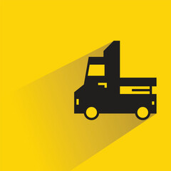 Wall Mural - truck icon with shadow on yellow background