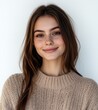 © Pavel - portrait of beautiful young woman with brown hair smiling, wearing casual sweater isolated on white background