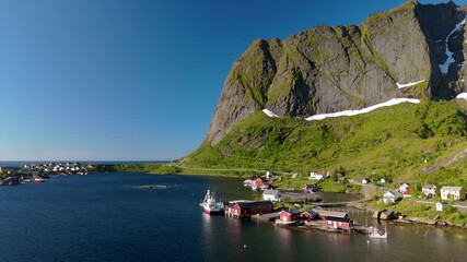 Wall Mural - reine, a picturesque fishing village in norways lofoten islands, offers stunning views of majestic m