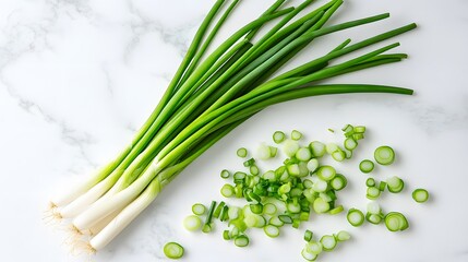 Wall Mural - Fresh green onions on white marble countertop, whole and chopped scallions, vibrant green color, culinary ingredients, clean white background, high contrast, food photography.