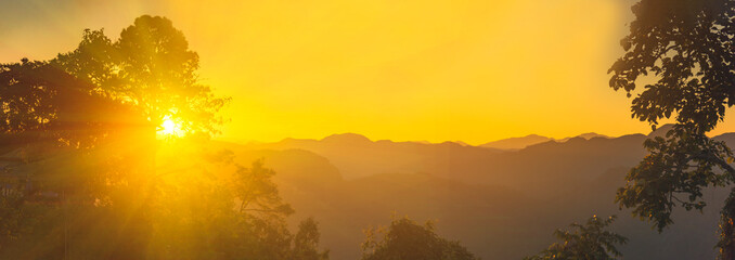 Wall Mural - Banner Scenic view dramatic beautiful sunset sky. Panorama Natural Sunset Sunrise on meadow silhouette shadow dark land. Vibrant dramatic sky in Countryside. Landscape Sky At Sunset with copy space