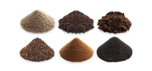 Six different types of soil isolated on a white background. The soil samples are arranged in a row, with the lightest soil on the left and the darkest soil on the right. 