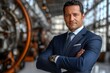 © Mai - Confident Businessman with Arms Crossed in Industrial Setting