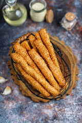 Wall Mural - Italian grissini or salted bread sticks with sesame seeds.