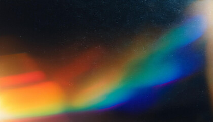 Poster - Abstract Light Refraction on Black Background. Spectrum of Rainbow Colors Blurred by Lens Flare, Featuring Vibrant Red, Orange, Green, and Blue Hues in a Soft, Ethereal Glow