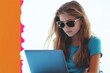 © melhak - Back to School Advertising - Teenage Girl Wearing Sunglasses Focused on Laptop with Colorful Collage Background