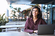 © Stock 4 You - Thoughtful young Arabic freelancer girl student using laptop pc for work sitting at desk outdoors. Middle eastern business woman working, studying on compute, thinking, dreaming aside. Copy space
