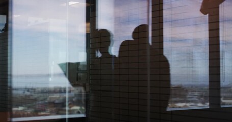 Poster - Business people, walk and silhouette in office, shadow or paperwork for partnership, discussion or window. Employees, documents and reading with reflection, planning or conversation in dark workplace