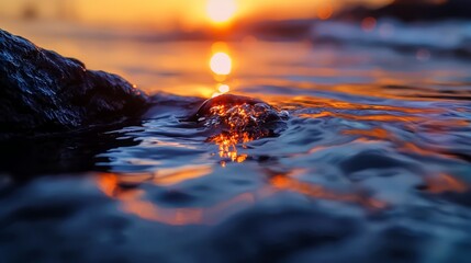 Wall Mural -  A tight shot of a submerged rock as the sun sets, with a serene foreground of water