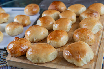 Freshly baked burger buns close up. Freshly baked buns home baking. Handmade.