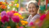 Eldery senior woman relaxing in garden with flowers background