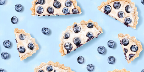 Wall Mural - Blueberry pie slices with crumb topping and powdered sugar on a light blue background, seamless pattern