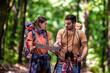 © ivanko80 - Hiker couple in the forest using map