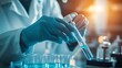 © Nijat - A scientist is a person working in a lab conducting medical research and healthcare studies, holding a test tube containing bacteria. A doctor, gloves, a vaccination, a close-up of a legionella sample