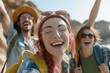 © Centric  - A close-up of a group of friends smiling and having fun during a sunny day adventure, wearing backpacks